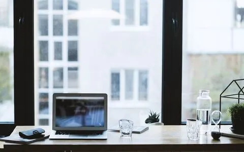Modern Sydney office with computers, monitors and power leads — all requiring regular test and tag compliance checks